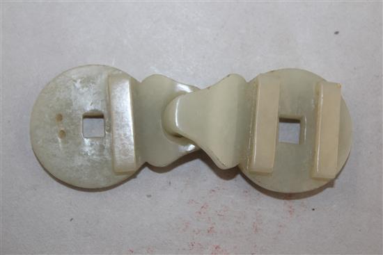 A Chinese celadon jade two piece belt buckle, 19th century, 9.8cm